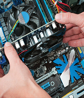 Compudoc installing a video card. Compudoc installing a video card.